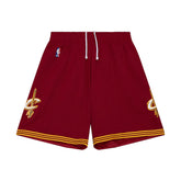 Red shorts with gold accents and logos on a white background