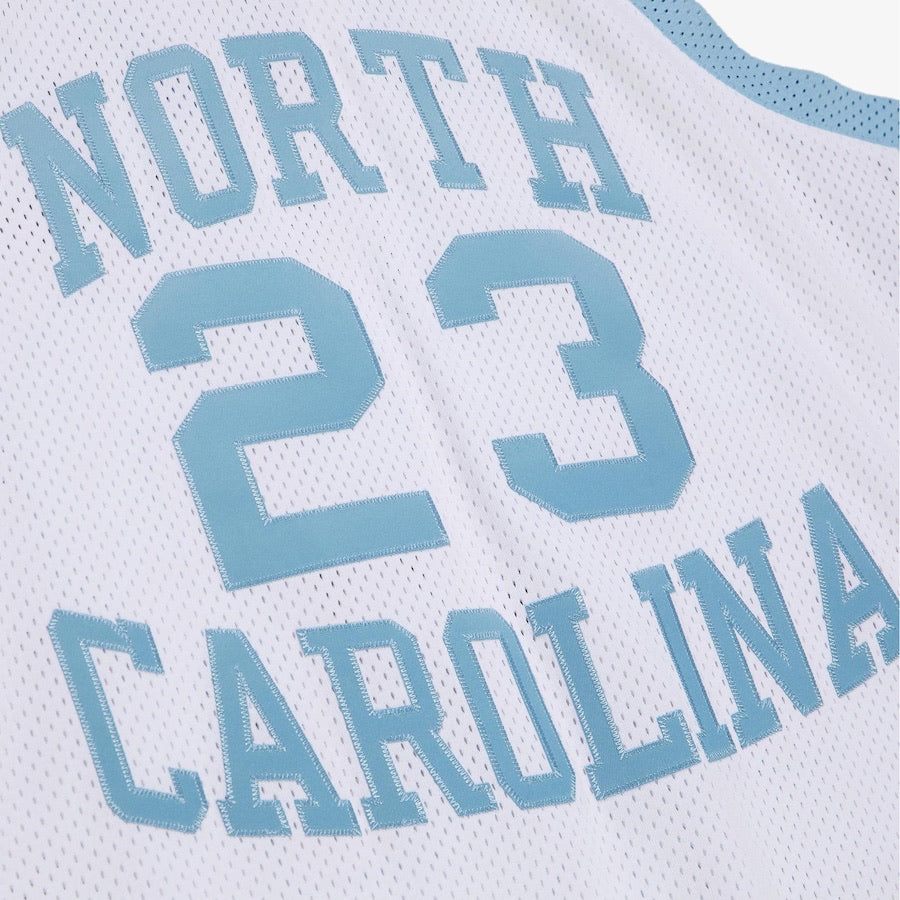 Close-up of a sports jersey with 'North Carolina' and number '23' printed on it.