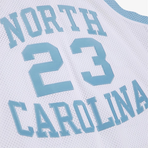 Close-up of a sports jersey with 'North Carolina' and number '23' printed on it.